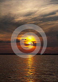 Summer landscape scenic fiery sunset over calm river