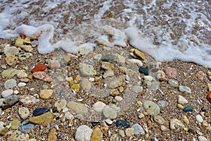 Summer landscape. Sea water and colored stones