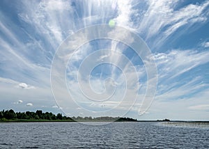 Summer landscape with the source of the river from the lake, beautiful clouds in the sky, the source of the river Salaca, Vecate,