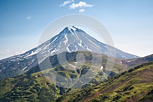 Summer landscape. Vilyuchinsky volcano against blue sky. Kamchatka peninsula photo