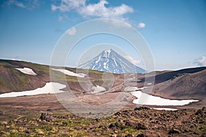 Summer landscape. Vilyuchinsky volcano against blue sky. Kamchatka peninsula photo
