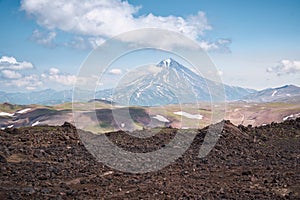 Summer landscape. Vilyuchinsky volcano against blue sky. Kamchatka peninsula photo