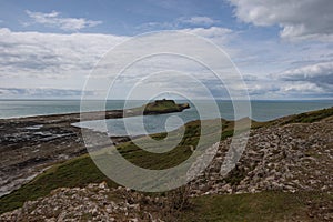 Summer landscape of Worm s Head and Rhosilli Bay