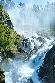 Summer Latefossen waterfall on mountain slope (Nor