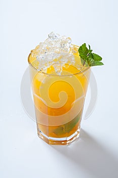 Summer lemonade with orange, ice and mint