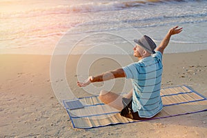 Summer lifestyle portrait male joy on the beach at the seashore life style morning at the sunrise, concept in travel