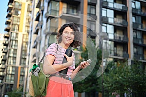 Summer lifestyle portrait of young stylish hipster woman smiling enjoy weekends