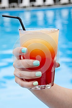 summer lifestyle at swimming pool. summer beach cocktail. summer vacation drink. drink cocktail at bar. refreshing alcoholic