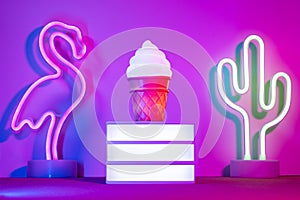 Summer with lightbox and flamingo,cactus and ice cream with neon pink and blue and green light on table with copy space.Trendy