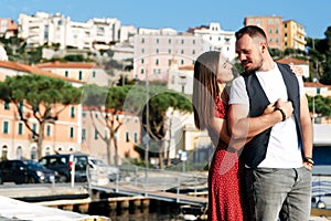 Summer love story in Italy. Couple on the pier