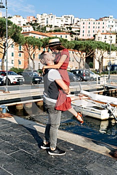 Summer love story in Italy. Couple on the pier