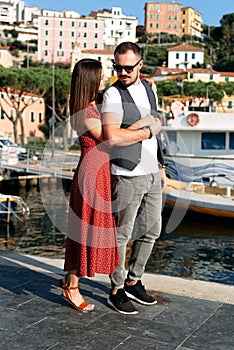 Summer love story in Italy. Couple on the pier
