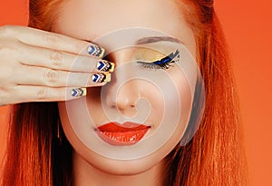 Summer makeup. Portrait of beautiful girl with yellow black eyeshadows manicure