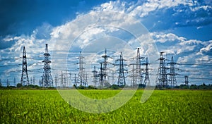 Summer meadow with high-voltage towers