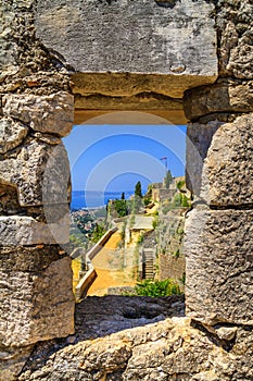 Summer mediterranean landscape - view from the loophole of the tower to the Klis Fortress near the city of Split