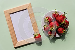 Summer mockup with wooden square frame, strawberries. Summer berry background. Flat lay. Summer concept.fruit frame