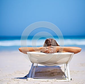 Summer mode - on. an attractive young woman enjoying a vacation at the beach.