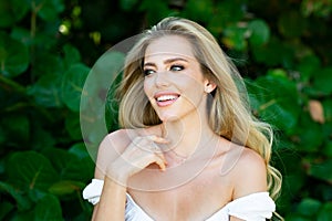 Summer model. Close up portrait of beautiful woman. Beautiful young girl in summer park outdoor. Pretty girl model on