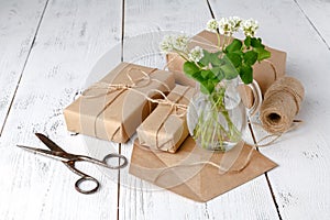 Summer mood with white clover on wooden table photo