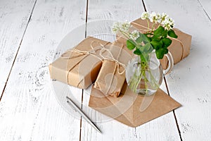 Summer mood with white clover on wooden table photo
