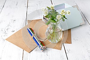 Summer mood with white clover on wooden table photo