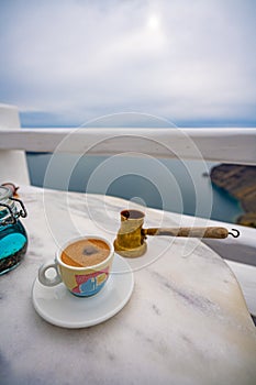 Summer morning, Enjoy Traditional Greek coffee at Greek Islands, Santorini, one of the most beautiful travel destinations of the