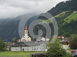 Summer morning foggy view on Neustift im Stubaital church at Stubaital or Stubai Valley near Innsbruck, Austria, green