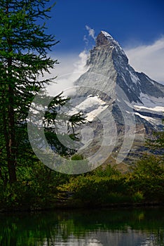 summer morning on the Grindjisee lake with Matterhorn peak backdrop in the in Swiss Alps, Zermatt location, Valais canton, Switz