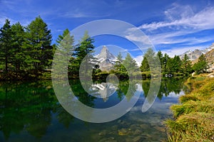 Summer morning on the Grindjisee lake with Matterhorn peak backd