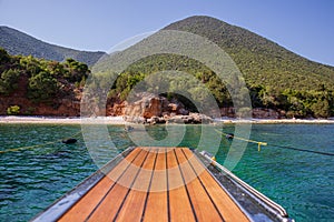 Summer morning the picturesque nature of ANTISAMOS beach with turquoise crystal clear water, white pebbles, green trees