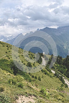 Summer mountain landscape with a hiking path in Svaneti region, Georgia, Asia. Snowcapped mountains in the background