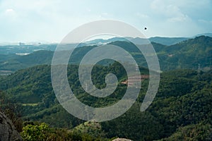 Summer mountain landscape. Mountain valley and electricity tower, electricity pylons, power tower. Broga Hill, Malaysia