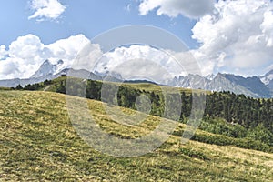 Summer mountain landscape near Mestia, Svaneti region, Georgia, Asia. Snowcapped mountains in the background. Blue sky