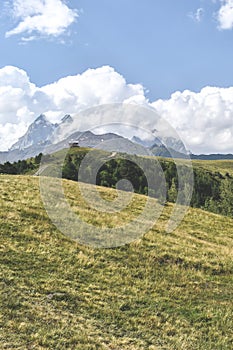 Summer mountain landscape near Mestia, Svaneti region, Georgia, Asia. Snowcapped mountains in the background. Blue sky