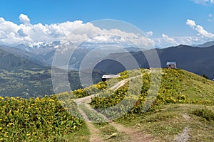 Summer mountain landscape near Mestia, Svaneti region, Georgia, Asia. Snowcapped mountains in the background. Blue sky