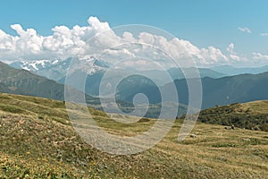 Summer mountain landscape near Mestia, Svaneti region, Georgia, Asia. Snowcapped mountains in the background. Blue sky