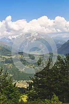 Summer mountain landscape near Mestia, Svaneti region, Georgia, Asia. Snowcapped mountains in the background. Blue sky