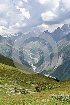 Summer mountain landscape in Svaneti region, Georgia, Asia. Snowcapped mountains in the background, Caucasus mountain