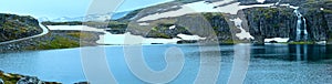 Summer mountain panorama with lake and snow (Norway)