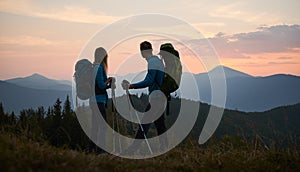 Summer mountain trekking of young family couple.