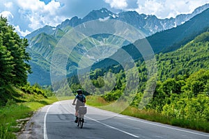 summer. mountains. cyclist rides on a mountain road