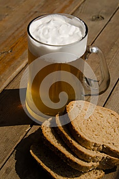 Summer. Mug of beer and bread