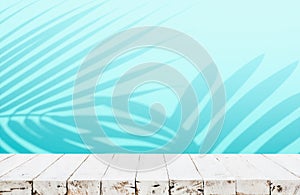 Summer and nature product display with wood table counter on blur coconut leaf background in blue color