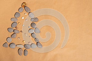 Summer New Year concept. Christmas tree made of smooth sea stone