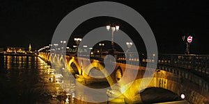 Summer night bridge pont de pierre crossing Garonne river in Bordeaux city france