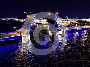 Summer night, Saint Petersburg, Russia. Neva River. Drawn bascule moveable Palace bridge. Winter Palace.