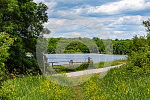 Summer in Omaha, Lake water, path, trail, green vegetation of Ed Zorinsky lake park, Omaha, Nebraska