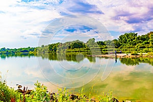 Summer in Omaha, Panorama Shoreline and sky reflections in the lake at Ed Zorinsky Lake Park Omaha NE