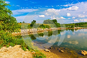 Summer in Omaha, Panorama Shoreline and sky reflections in the lake at Ed Zorinsky Lake Park Omaha NE