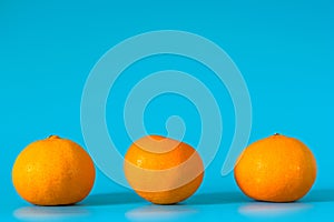 Summer of orange fruit on blue background